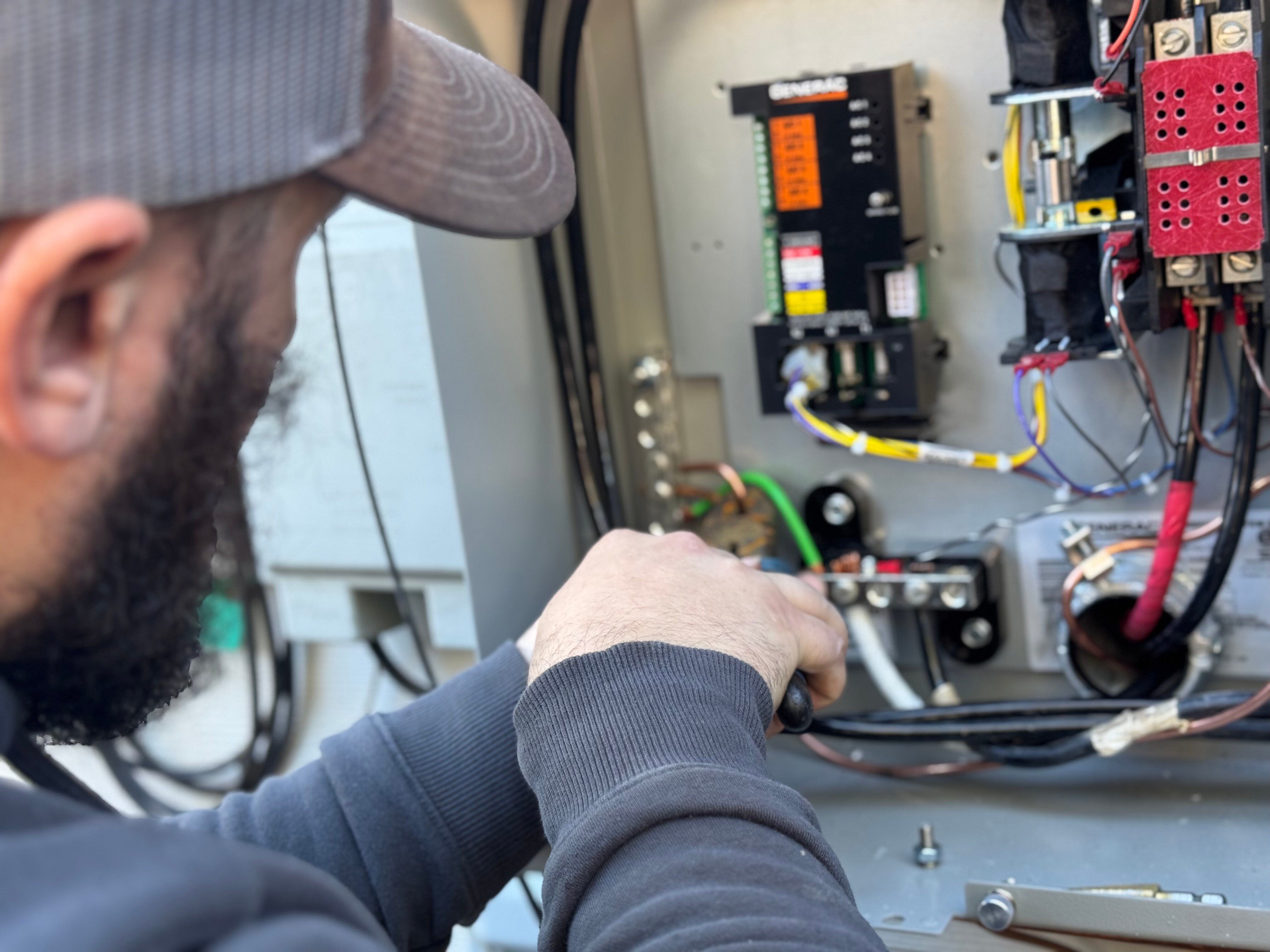 Suncoast Power Solutions Man Working on Generator