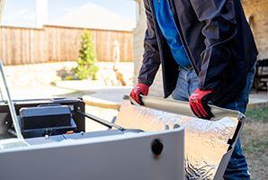 Suncoast Power Solutions - Person Inspecting Generator